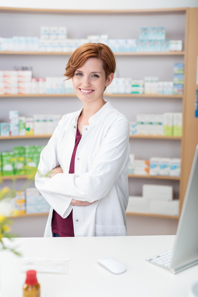 Attractive friendly young female pharmacist - Photo, image