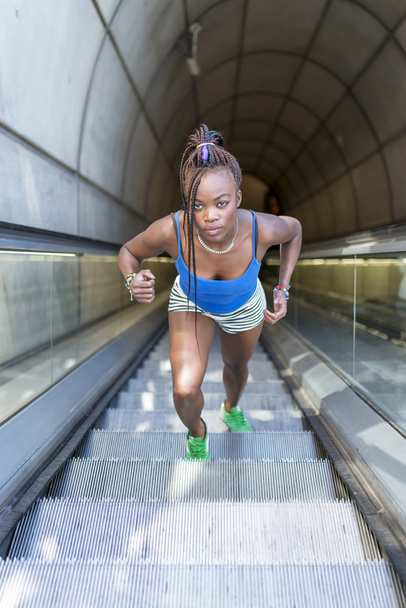 Beautiful sporty african woman exercise and climb stairs, health - Photo, Image