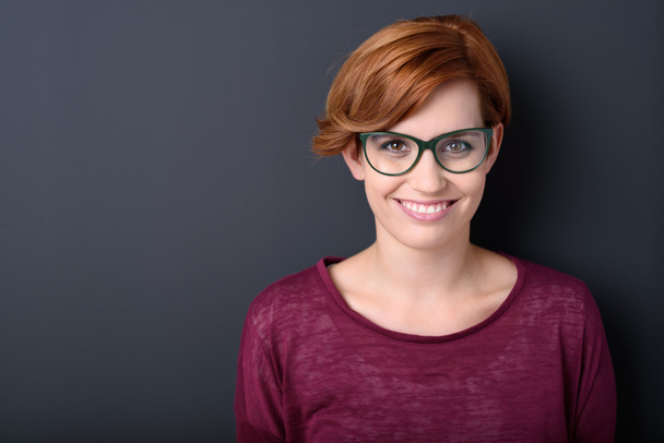 woman wearing glasses with a lovely smile - Fotó, kép