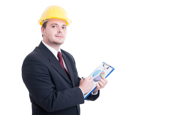 Contractor or salesman, analyzing financial chart - Фото, изображение