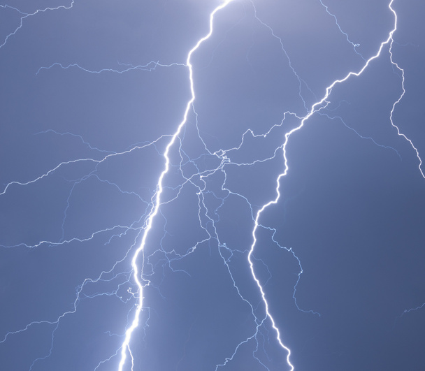Heavy clouds bringing thunder, lightnings and storm - Фото, изображение