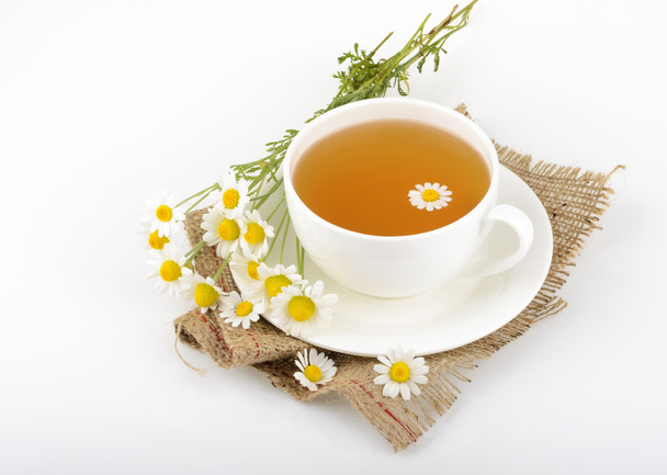Taza de té y manzanillas
 - Foto, Imagen