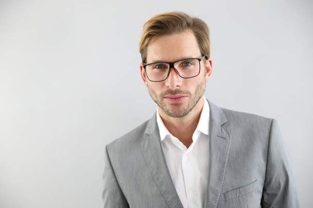 Businessman with eyeglasses on standing - Foto, Imagen