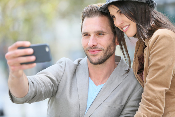 Cheerful young couple taking selfie  - Foto, Imagem