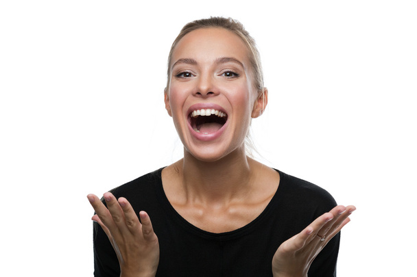 Portrait of surprised woman on white background - Photo, Image