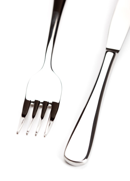 Ασημένιο μαχαίρι και πιρούνι σε λευκό φόντο - Φωτογραφία, εικόνα