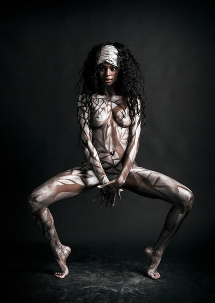 Beautiful african model body painted with polygons posing - Фото, зображення