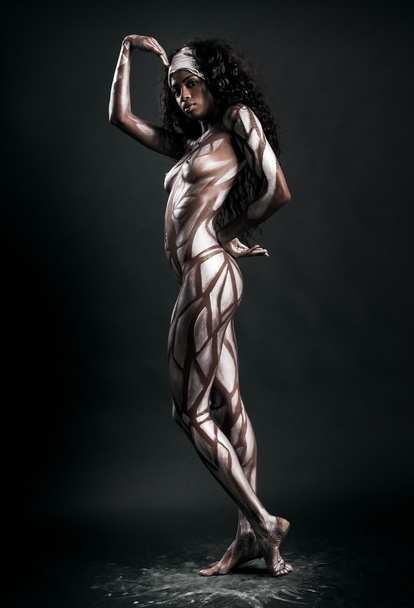Sexy african model posing with body painted with polygons - Foto, Imagem