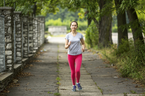 Young jogger girl running - Valokuva, kuva