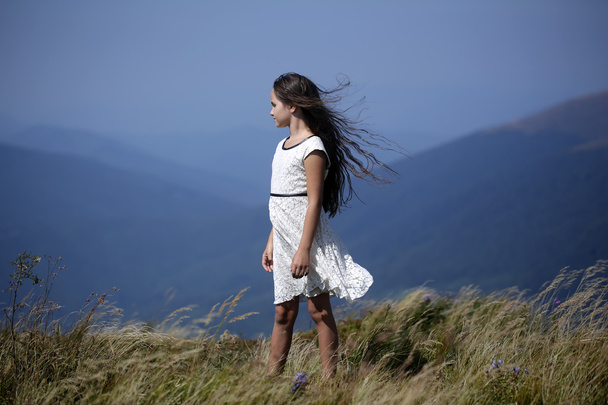 Small girl in mountains - Фото, зображення