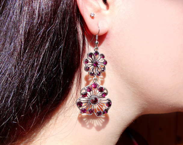 earrings jewellery with bright crystals in ear - Photo, Image