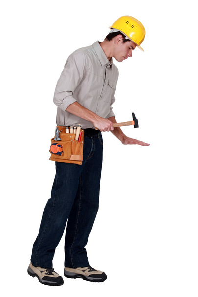 Carpenter holding hammer - 写真・画像