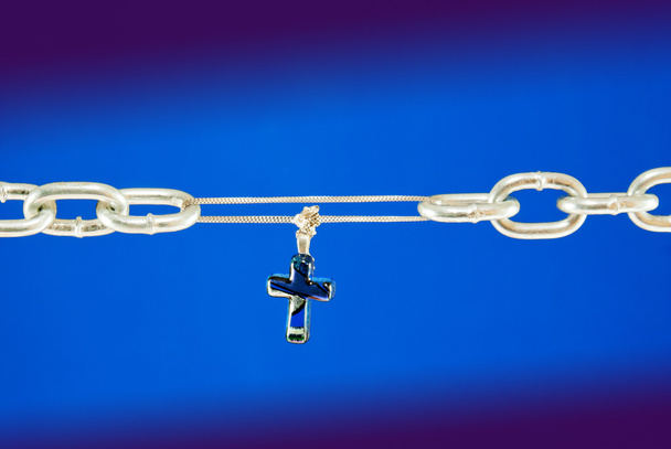 Broken chain connected with a cross - Photo, Image