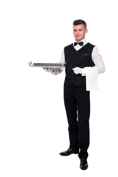 Retrato de joven camarero sonriente feliz con bandeja aislada en
 - Foto, imagen