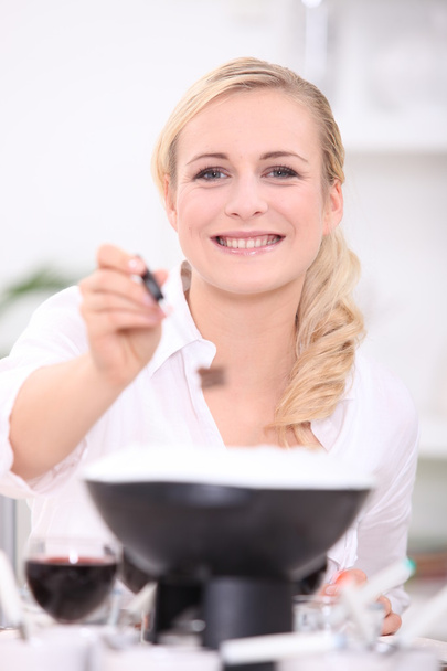 Woman cooking fondue - Photo, image