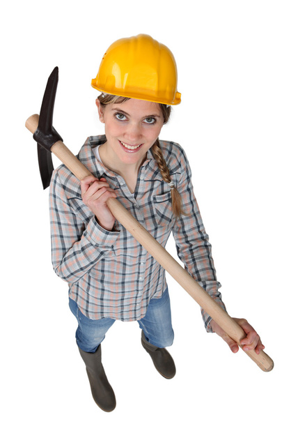 Smiling woman with a pickaxe - Foto, Imagen