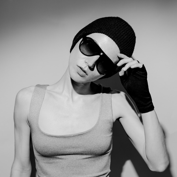 Black and white photo. Girl in fashion accessories - Zdjęcie, obraz