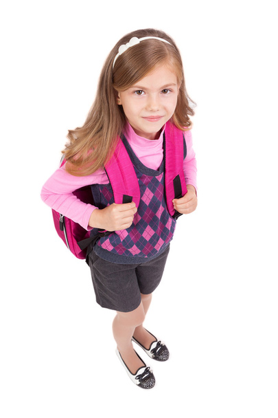 menina da escola com uma mochila em um fundo branco sorrindo
 - Foto, Imagem