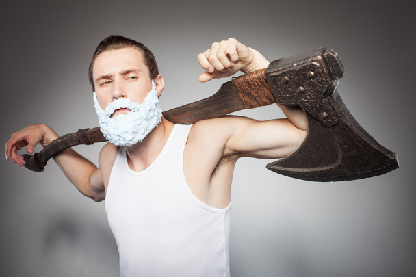 Handsome young hipster guy threatens with axe - Foto, Bild