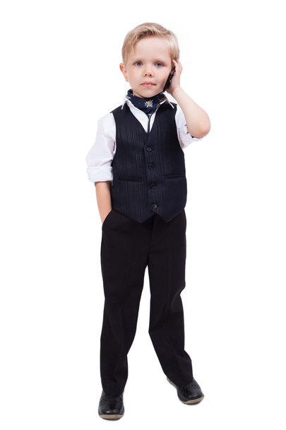 little schoolboy on a white background talking on the phone - Fotografie, Obrázek