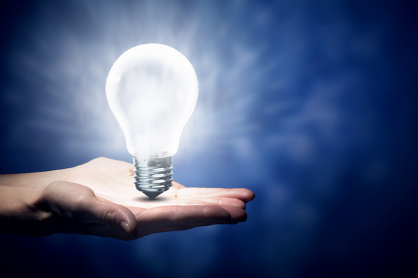 Light bulb in hand - Photo, image