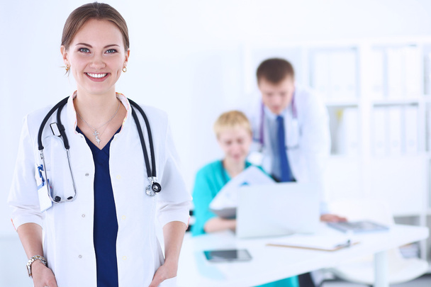Woman doctor standing with stethoscope at hospital - Valokuva, kuva