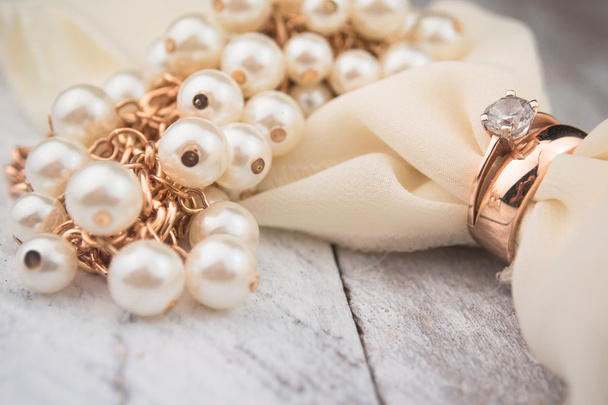 Golden wedding rings on white wood background - Photo, Image