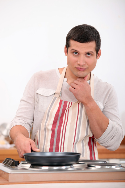 Man cooking alone on kitchen - Фото, зображення