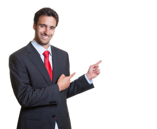 Pointing hispanic businessman with suit - Valokuva, kuva