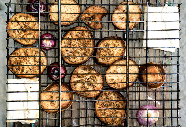 Contrast grill grid with fried zucchini, violet onion and pita bread with cheese - Photo, Image