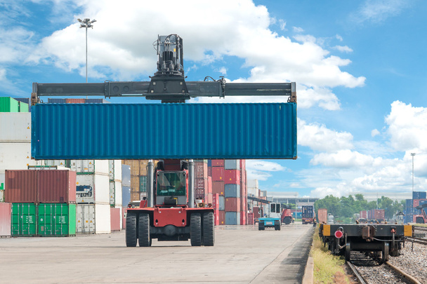 forklift handling container box loading to freight train - Photo, Image