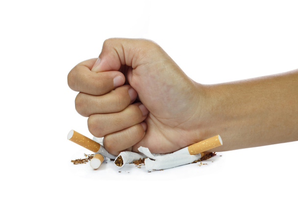 fist breaking cigarette stop smoking concept on white background - Photo, Image