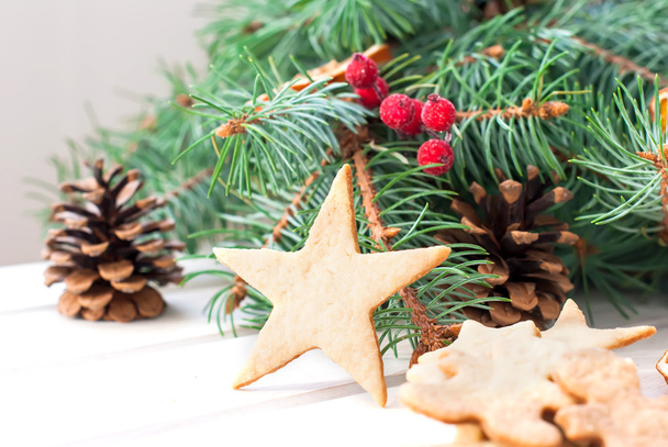homemade cookies on a star background fir branches - Foto, imagen