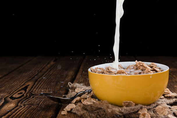 Pouring Milk on a portion of Cornflakes - Photo, image