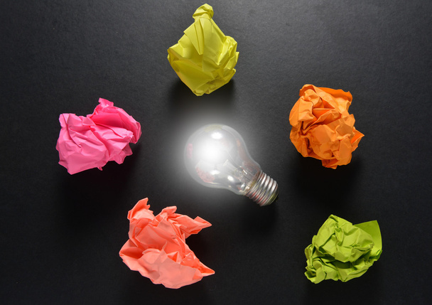 great idea solution concept with crumpled colorful paper and light bulb - Photo, Image