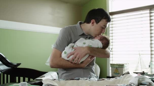 Father embracing baby boy - Video, Çekim