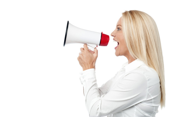 business woman with a megaphone making an announcement - Foto, Imagen