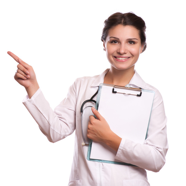 Portrait of young female doctor showing something or copyspase for product or sign text, - Photo, image