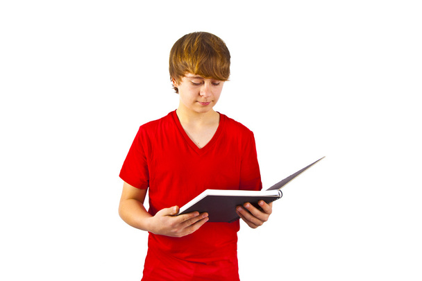 slimme jongen in een boek lezen - Foto, afbeelding