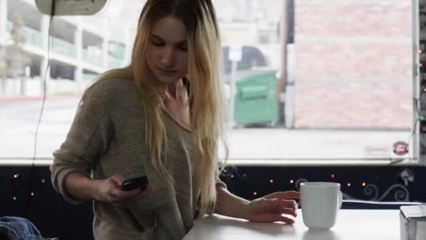 Young woman drinking coffee - Felvétel, videó