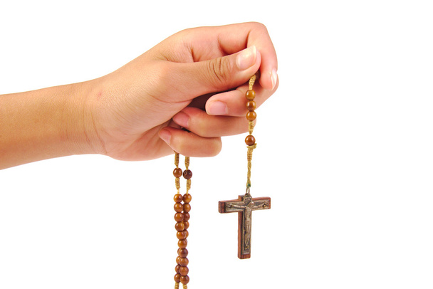Close up of hand with catholic rosary isolated on a white background - Photo, Image