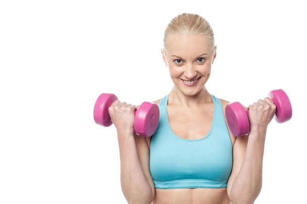 woman working out with dumbbells - Fotoğraf, Görsel