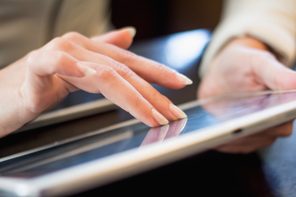 woman works on the digital tablet, soft focus, close up - Photo, Image