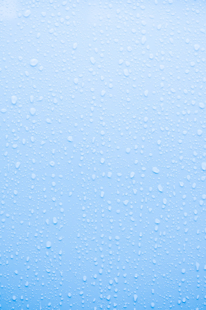 σταγόνα νερό στην επιφάνεια του μπλε - Φωτογραφία, εικόνα