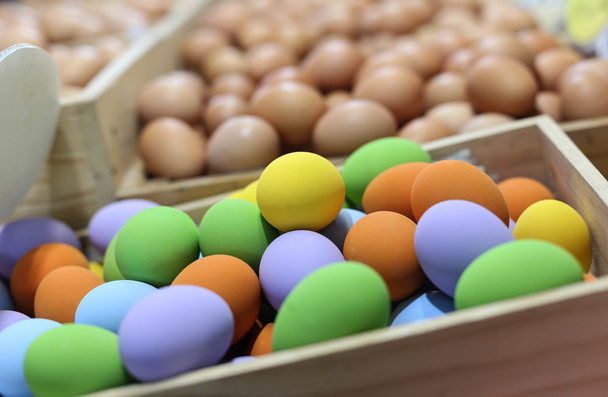 Colorful easter eggs in the wooden box - Photo, Image