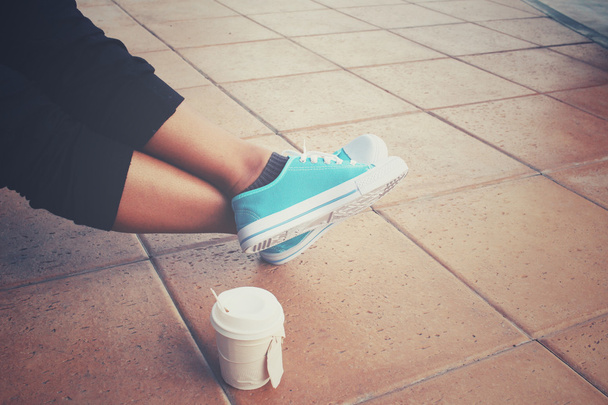 Coffee paper cup with sneakers - Photo, Image