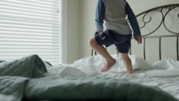 boy having fun on bed - Felvétel, videó