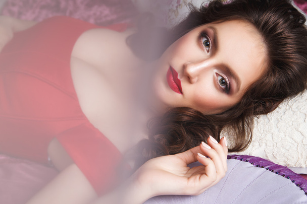 Close-up portrait of beautiful brunette young woman in elegant luxury red dress - Фото, изображение