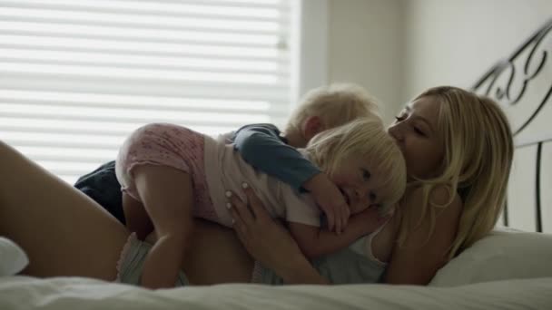 pregnant mother hugging children - Кадри, відео