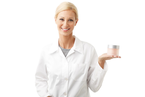 beauty therapist holding hand jar of cream - Foto, Imagem